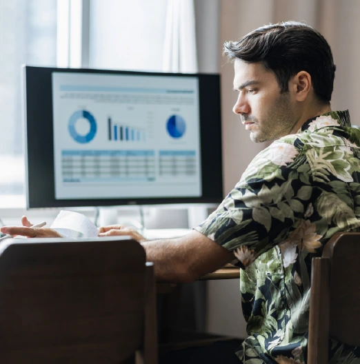 Man reviewing data charts