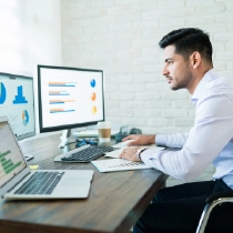 CRM Solutions Professional analyzing data charts