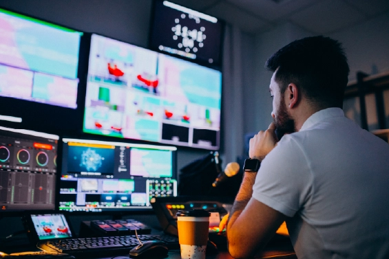 IT expert monitoring screens