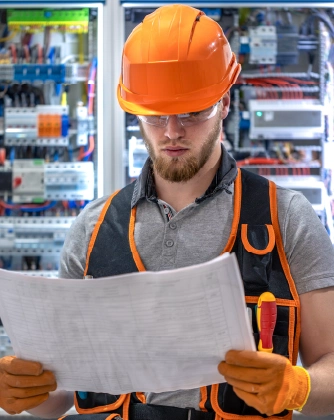 Electrician reviewing technical plans