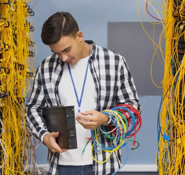 Technician managing server cables