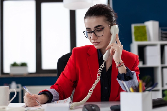 Woman answering office phone