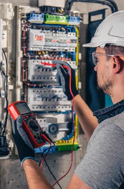 Electrician testing circuit panel