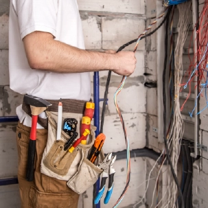 Electrician holding power cables
