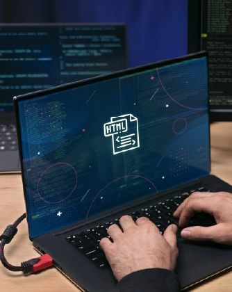 Hands typing on laptop