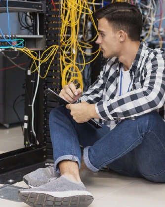 Technician checking server rack