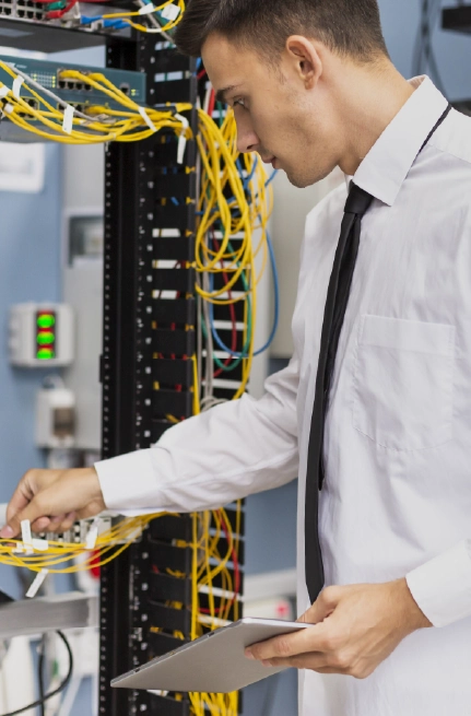 Technician inspecting server rack